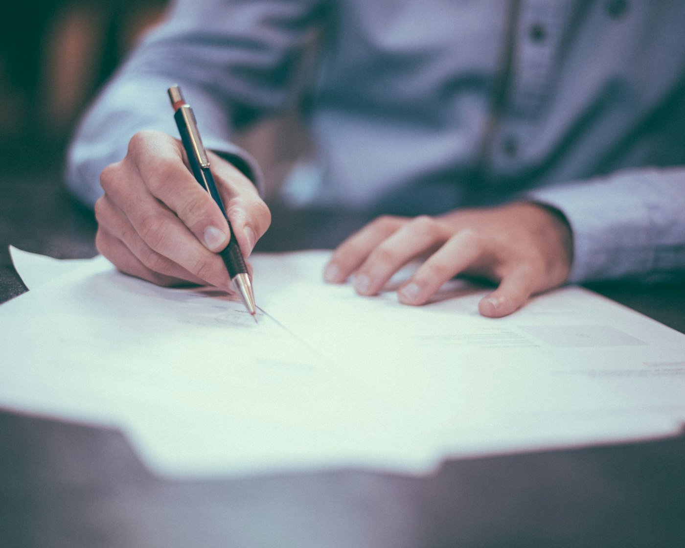Consultant signing client documents