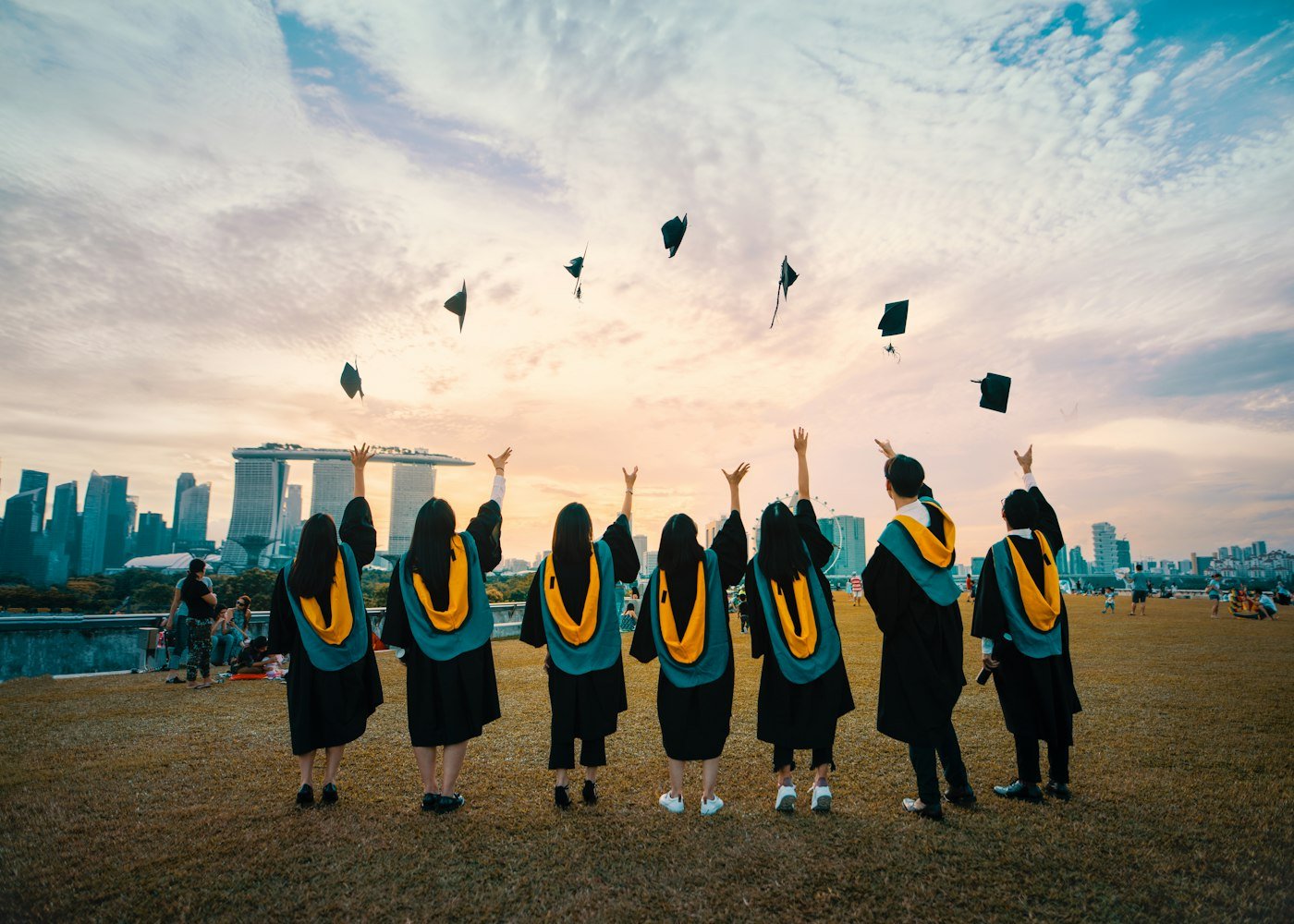 Graduates throwing caps in the air