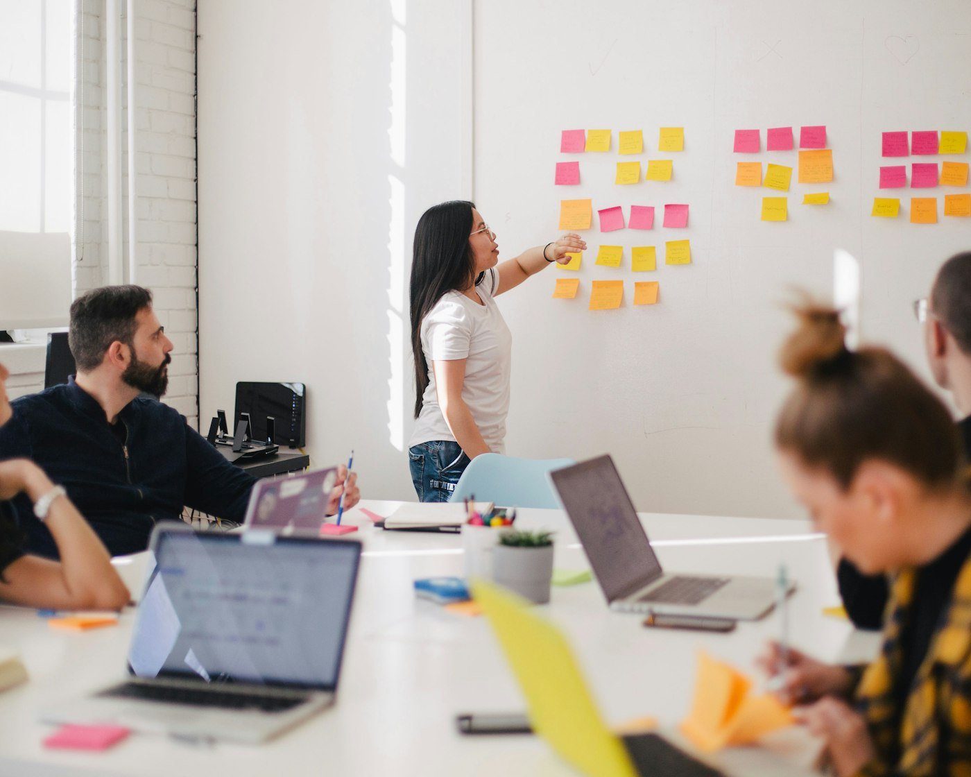 Team mapping out a client journey on a whiteboard